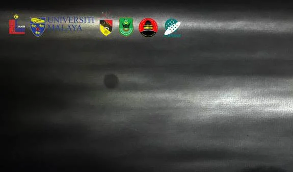 A dark sky with clouds and a moon Description automatically generated